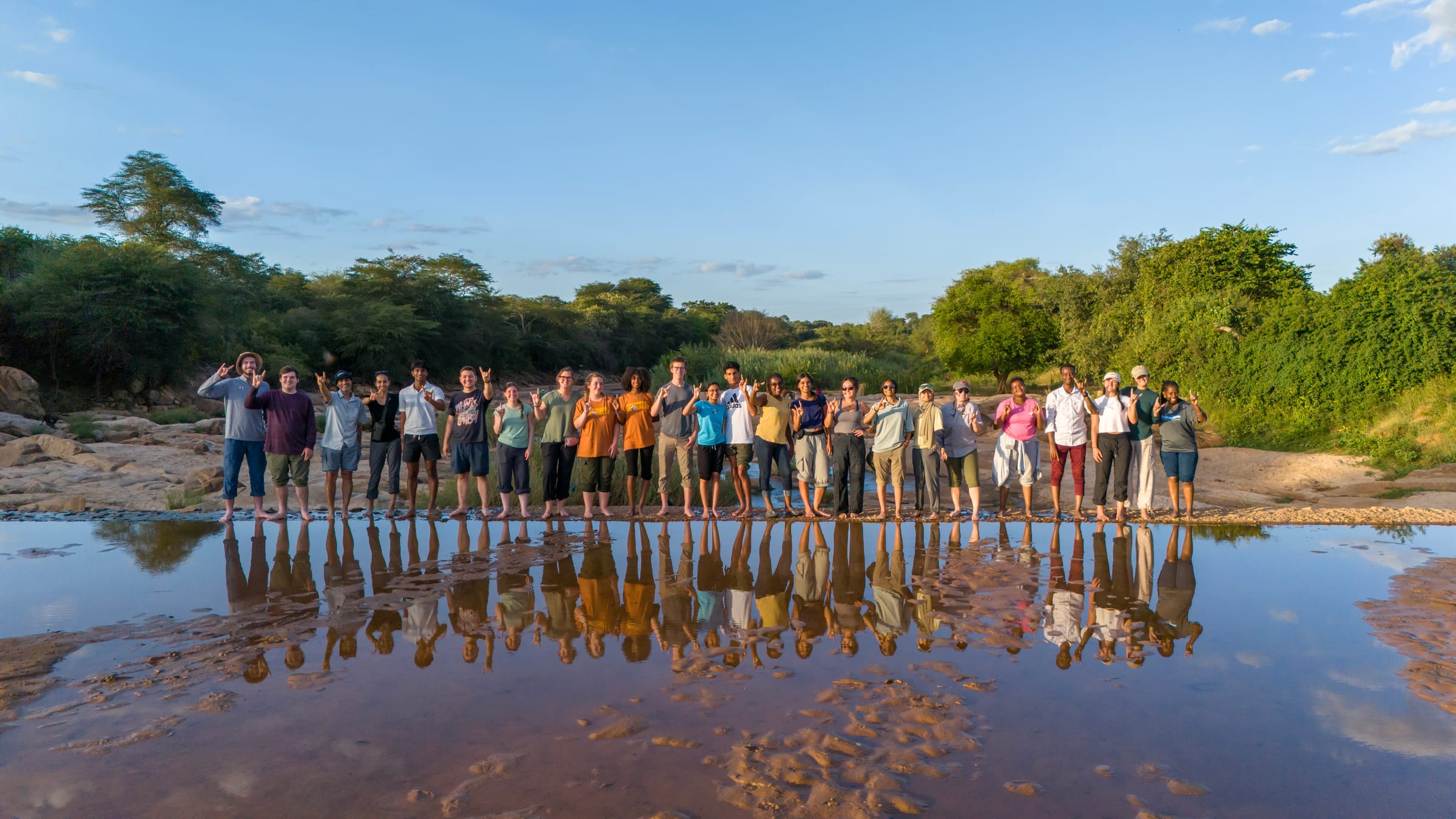 The UT GivePower trek team gathered in Kenya at golden hour