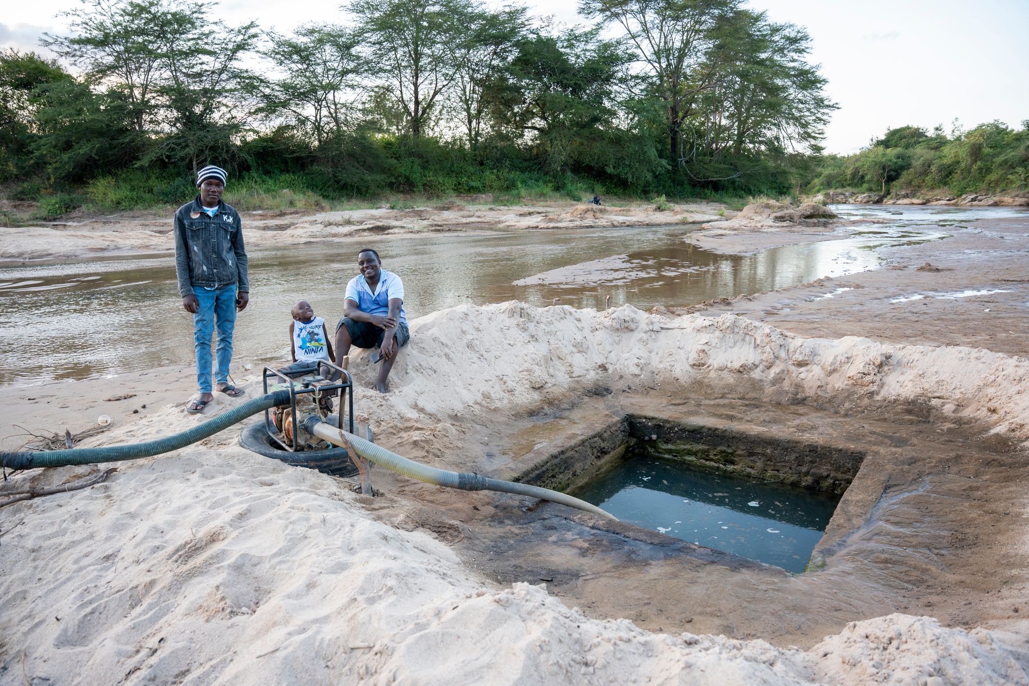 A solar-powered pump drawing water from a Kenyan riverbed
